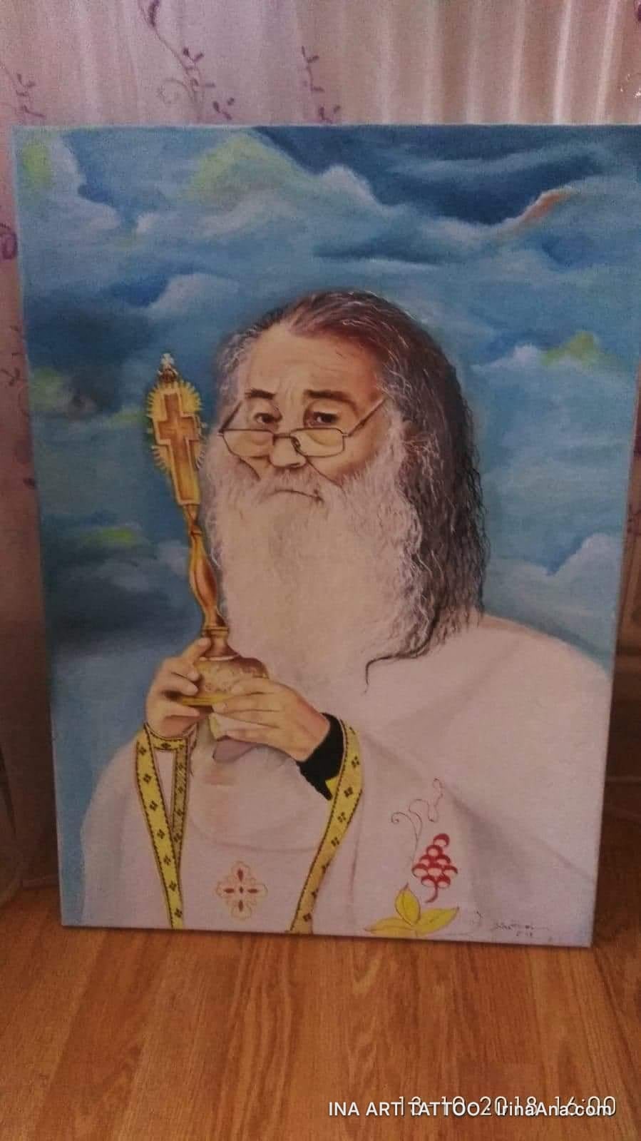 Oil painting of an Orthodox priest with a white beard, glasses, and white vestments, holding a golden cross. The background…