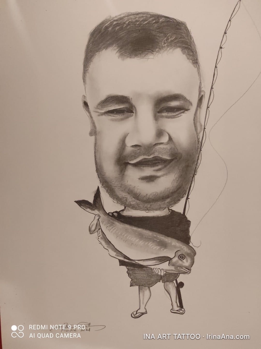 Pencil caricature of a smiling man with a large head, holding a big fish and a fishing rod.